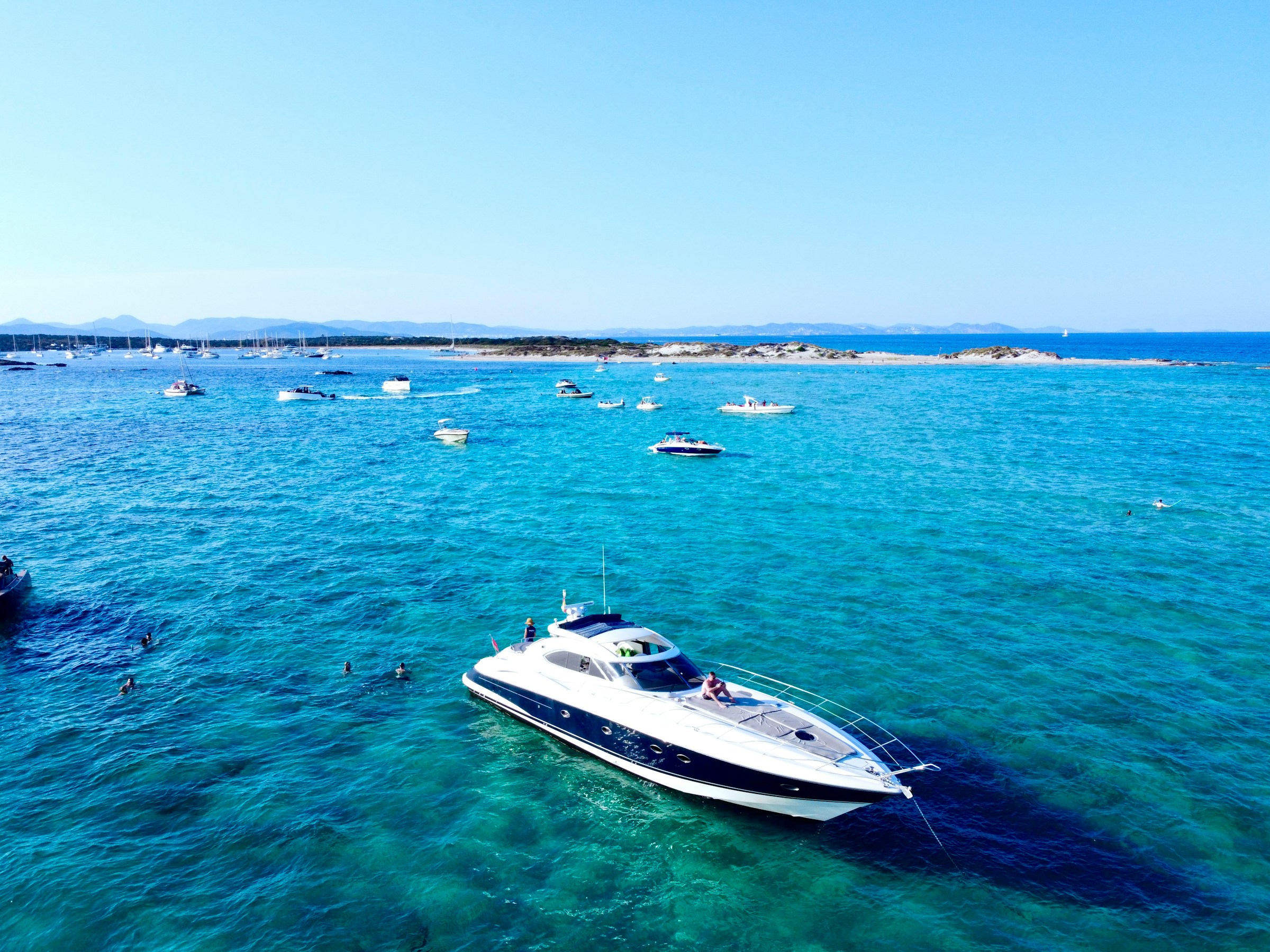 Set sail on a luxury yacht in Ibiza’s crystal-clear waters – book your exclusive experience with Avenue Travel Luxury yacht sailing on the crystal-clear waters of Ibiza – Avenue Travel