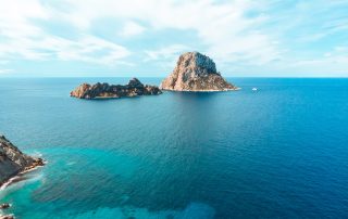 Clear blue waters and beautiful coastline of Ibiza – Avenue Travel