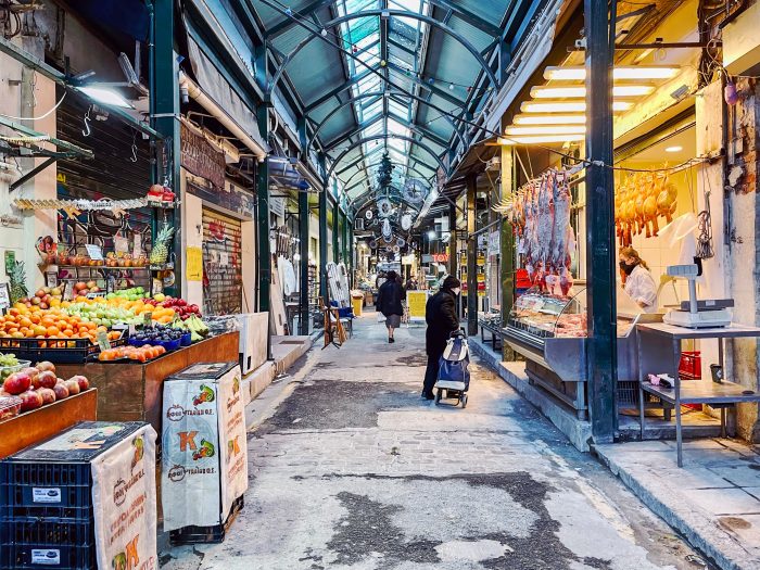 Busy market in Thessaloniki with fresh produce, local goods, and vibrant stalls